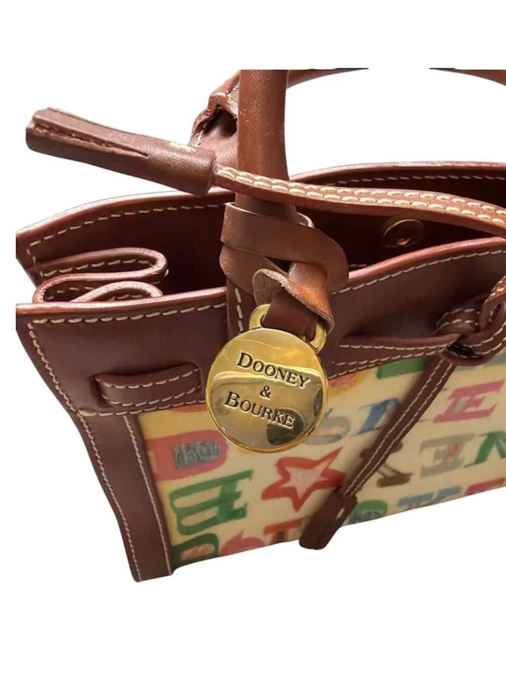 Dooney & Bourke graffiti signature multicolor coated handbag.